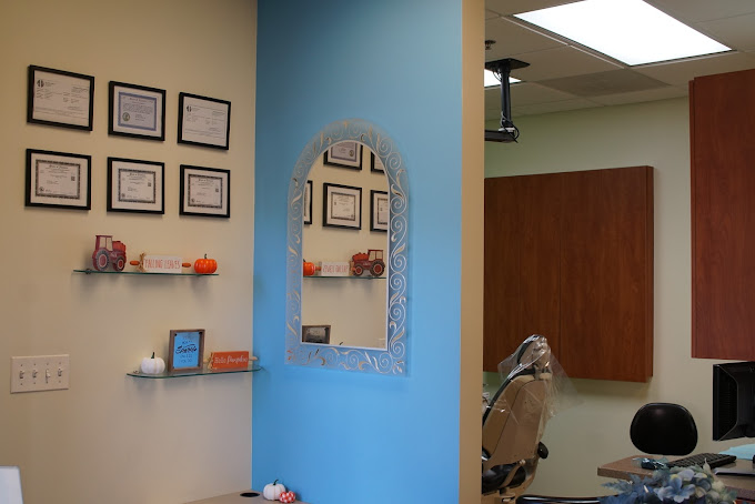 Interior image showing a mirror and a partial dental operatory.